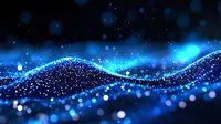 Glowing blue wave of particles with bokeh effect on dark background creates dynamic flowing motion and abstract technological atmosphere.