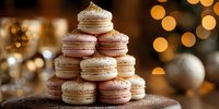 Elegant pyramid of pastel macarons stacked on dessert stand with festive bokeh lights in background, creating luxurious holiday atmosphere.