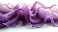Elegant flowing purple silk fabric creates graceful waves and folds against white background, showcasing luxurious textile movement and soft draping effects.