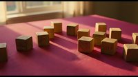 Wooden blocks arranged on pink fabric surface with warm sunlight casting shadows, suitable for educational materials, child development concepts, and creative learning projects.
