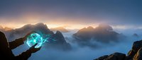 Hand holding glowing blue orb above misty mountain landscape at sunrise, symbolizing energy, magic, and power for fantasy, technology, and spiritual concepts.
