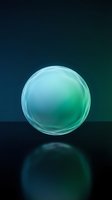 Translucent glass sphere with cyan and green gradient, isolated on dark background with reflection, suitable for design, web graphics, and digital projects.