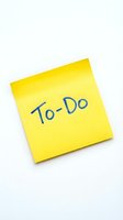 Yellow sticky note with "To-Do" handwritten in blue marker on white background, isolated for productivity, planning, and organization design projects.