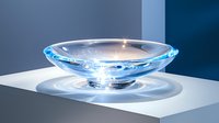 Elegant glass bowl with blue luminescent glow on white surface casting dramatic shadows against dark background, creating modern minimalist composition.