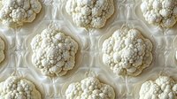 Fresh white cauliflower heads arranged in seamless pattern on light background, organic vegetable texture for healthy food and cooking design backgrounds.