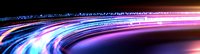 Dynamic light trails with vibrant blue and pink neon streaks curve across dark background creating futuristic motion effect, suitable for technology concepts.