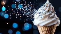 Soft serve vanilla ice cream cone with black and blue sprinkles on dark background with bokeh lights creating magical dessert atmosphere. For food blogs and menus.