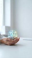 Hands holding glowing digital security shield with lock and heart icons representing data protection and cybersecurity in modern office environment.