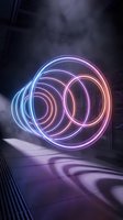 Glowing neon circles creating dynamic light trails in futuristic corridor with purple and blue illumination for modern digital design projects.