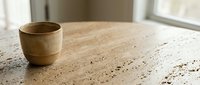Wooden cup on terrazzo countertop with natural light from window, minimalist interior design workspace for home decor and lifestyle content.