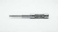 Professional chrome screwdriver with Phillips head tip isolated on white background for tool and hardware design projects.