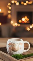 Cute sheep-shaped mug with warm bokeh lights and evergreen branch on wooden surface, cozy holiday setting for seasonal beverage and festive home decor.