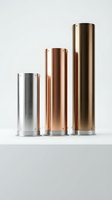Three metallic cylindrical containers in silver copper and gold finishes arranged by height on white background for product design and packaging concepts.