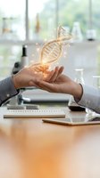 Scientist holding glowing DNA helix model in laboratory setting, representing genetic research, biotechnology innovation, and scientific discovery in modern lab environment.