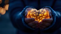 Glowing heart-shaped fairy lights held in cozy mittened hands against dark blue winter background, creating magical romantic atmosphere. Perfect for holiday designs.