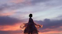 Young woman silhouette against dramatic sunset sky with flowing dress and hair creating peaceful meditation moment during golden hour twilight.