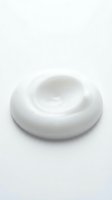 Creamy white swirl of moisturizer, lotion, or skincare product isolated on white background, ready for cosmetics, beauty, and wellness design projects.