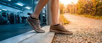 Male runner transitioning from indoor gym to outdoor trail, wearing brown athletic shoes, demonstrating fitness journey and active lifestyle for sports and wellness content.