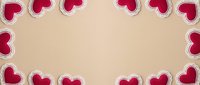 Red hearts border frame on beige background for Valentine's Day cards, romantic designs, love messages, wedding invitations and holiday decorations.