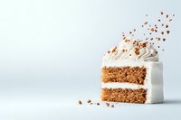 Slice of layered carrot cake with cream cheese frosting and walnut crumbs floating in air against light background, minimalist food photography style.