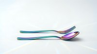 Modern rainbow iridescent spoons with holographic finish on white background, isolated cutlery set for kitchen design and culinary branding projects.