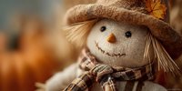 Charming scarecrow decoration with burlap hat and plaid shirt perfect for autumn harvest displays and seasonal home decor during fall festivities.