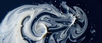 Swirling navy and white liquid marble ink creating abstract fluid art patterns with dynamic motion and organic flowing textures.