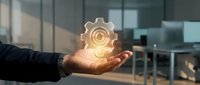 Male professional holding glowing gear symbol representing innovation, technology, and business solutions in modern corporate office environment.