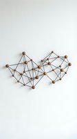 Abstract geometric network structure with wooden spheres and black wire connections on white background for modern interior design concepts.