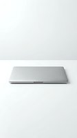 Closed silver laptop computer isolated on white background for technology and business design projects.