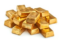 Stack of shiny gold bars on white background, representing wealth, financial investment and precious metal trading. Isolated photo for banking concepts.