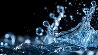 Dynamic water splash with droplets frozen in motion against dark background, creating dramatic aqua shapes with bokeh light effects and crystalline clarity.