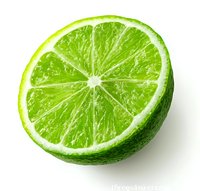 Fresh lime half slice showing juicy pulp and segments isolated on white background for culinary and beverage design projects.
