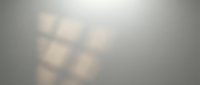 Soft blurred warm lights creating bokeh effect on neutral gray background for overlay and design projects.