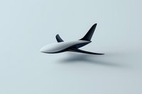Minimalist model of futuristic airplane with sleek white body and dark wings on light background, concept for aviation and transportation design.