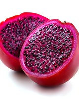 Fresh red dragon fruit halves showing vibrant pink flesh and black seeds in close-up macro shot on white background, ready for healthy eating and food styling.
