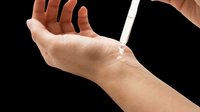 Serum dropper applying clear liquid onto a woman's wrist, isolated on transparent background, ready for skincare, beauty, cosmetic design use.