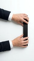 Businessman hands holding black folder on white background isolated for business presentations and corporate design projects.