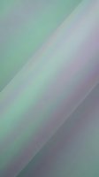 Abstract holographic gradient background with soft green and purple hues flowing in diagonal geometric shapes for modern digital design projects.