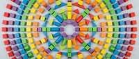 Vibrant marker pen collection arranged in concentric circular pattern displaying full spectrum of colors from red through blue, organized by hue for art and design projects.