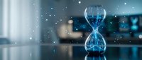 Digital hourglass with glowing blue light and floating particles in modern office environment for time management and productivity concepts.