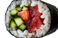 Fresh sushi roll with tuna, cucumber and carrot wrapped in nori seaweed and white rice, macro close up view showing vibrant ingredients and texture.