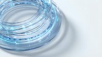 Glowing blue fiber optic cable coiled in a ring on white background, emitting digital light particles for technology and data concepts.