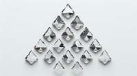 Minimalist geometric composition with folded paper triangles arranged in pyramid shape on light background, creating dynamic shadows and depth. Perfect for modern design projects.