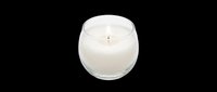 Scented candle in clear glass jar with white wax and lit wick, isolated on transparent background. Ready for design use on product packaging, e-commerce, print-on-demand, and sublimation projects.
