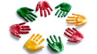 Colorful handprints arranged in circle on white background, red green and yellow paint palm impressions. Isolated creative design element for childhood, diversity and teamwork concepts.
