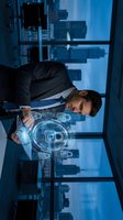 Young male professional in business suit examining digital holographic interface with blockchain and cryptocurrency symbols in modern high-rise office overlooking city skyline.