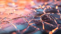 Shattered glass fragments with pink and blue light reflections creating abstract pattern. Broken mirror pieces catch sunset glow in artistic macro photography.