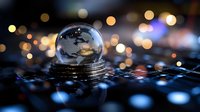 Crystal glass sphere on stack of coins reflecting sunset sky with bokeh lights in background creating magical atmosphere for financial concepts.