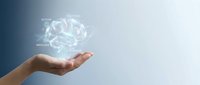 Hand holding glowing digital brain hologram representing artificial intelligence, machine learning, and futuristic technology concepts for business innovation.